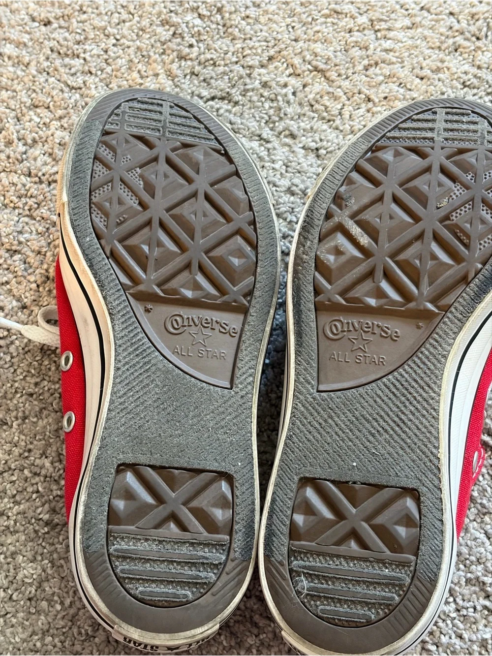 Converse red low-top sneakers with white laces
